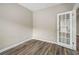 Home office with hardwood floors and door to entryway at 320 Pintail Ct, Suwanee, GA 30024