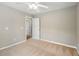 Well-lit bedroom with carpet and ceiling fan at 320 Pintail Ct, Suwanee, GA 30024