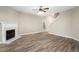 Spacious living room with hardwood floors and fireplace at 320 Pintail Ct, Suwanee, GA 30024