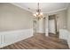 Spacious dining room with hardwood floors and access to kitchen and other rooms at 320 Pintail Ct, Suwanee, GA 30024