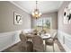 Dining room with hardwood floors, chandelier, and wainscoting at 320 Pintail Ct, Suwanee, GA 30024
