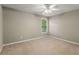Spacious bedroom with large window and ceiling fan at 320 Pintail Ct, Suwanee, GA 30024