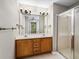 Bathroom featuring double vanity and shower at 320 Pintail Ct, Suwanee, GA 30024