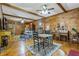 Charming dining area with wooden table and chairs, in a rustic log cabin at 200 Ross St, Carrollton, GA 30116