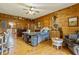 Large bedroom with wood walls, a queen bed, and access to a bathroom and balcony at 200 Ross St, Carrollton, GA 30116
