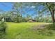Log cabin viewed from the side showcasing large yard at 200 Ross St, Carrollton, GA 30116