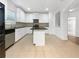 Modern kitchen featuring white cabinets and a large island at 2669 Saint Paul Sw Dr, Atlanta, GA 30331
