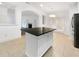 Kitchen island with a black granite countertop at 2669 Saint Paul Sw Dr, Atlanta, GA 30331