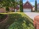 Two story brick house with attached garage at 2669 Saint Paul Sw Dr, Atlanta, GA 30331