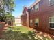 Brick house with pergola and grassy backyard at 2669 Saint Paul Sw Dr, Atlanta, GA 30331