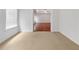 Bright bedroom with carpet and a view of another room at 2669 Saint Paul Sw Dr, Atlanta, GA 30331