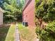 Brick house with HVAC units and side yard at 2669 Saint Paul Sw Dr, Atlanta, GA 30331