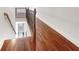 Elegant hallway with hardwood floors and wrought iron railing at 2669 Saint Paul Sw Dr, Atlanta, GA 30331