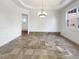 Formal dining room with chandelier and tile floors at 2669 Saint Paul Sw Dr, Atlanta, GA 30331