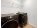 Laundry room with washer, dryer and shelving at 2669 Saint Paul Sw Dr, Atlanta, GA 30331