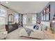 Main bedroom with a view, dresser, and large windows at 21 Bennett Farm Dr, Loganville, GA 30052