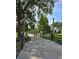 Gated driveway entrance to a farmhouse with fenced pastures at 3898 Ridge Rd, Buford, GA 30519