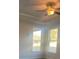 Bright bedroom with two windows and ceiling fan at 2404 Anhinga Dr, Loganville, GA 30052