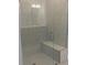 Large walk-in shower with built-in seat and glass enclosure at 2404 Anhinga Dr, Loganville, GA 30052