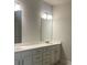 Elegant bathroom with double vanity and large mirror at 2414 Anhinga Dr, Loganville, GA 30052