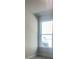 Simple bedroom with a large window and neutral colored walls at 2414 Anhinga Dr, Loganville, GA 30052