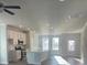 Open kitchen with island and stainless steel appliances at 2414 Anhinga Dr, Loganville, GA 30052
