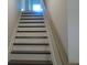 Modern staircase with dark wood treads and light risers at 559 Fundao Ln # 21, Lawrenceville, GA 30046