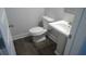 Small half bathroom with pedestal sink and vinyl plank flooring at 559 Fundao Ln # 21, Lawrenceville, GA 30046