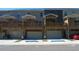 Three townhouses with attached garages and decks at 559 Fundao Ln # 21, Lawrenceville, GA 30046