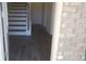 Front entry with staircase and dark gray luxury vinyl plank flooring at 559 Fundao Ln # 21, Lawrenceville, GA 30046