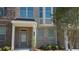 Townhouse exterior with landscaping at 559 Fundao Ln # 21, Lawrenceville, GA 30046