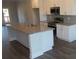 Kitchen island with granite countertop and stainless steel appliances at 559 Fundao Ln # 21, Lawrenceville, GA 30046