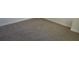 Neutral-toned carpeting in a spacious room at 559 Fundao Ln # 21, Lawrenceville, GA 30046