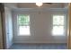 Bright bedroom featuring two large windows and neutral walls at 559 Fundao Ln # 21, Lawrenceville, GA 30046