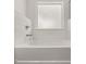 Bathroom with soaking tub, subway tile, and a window at 1641 Lacebark Elm Way, Lawrenceville, GA 30045