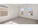 Bedroom with carpet and two windows at 1641 Lacebark Elm Way, Lawrenceville, GA 30045