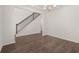 Spacious dining room featuring hardwood floors and elegant staircase at 1641 Lacebark Elm Way, Lawrenceville, GA 30045