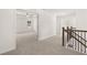 Upstairs hallway with carpet and doors to bedrooms at 1641 Lacebark Elm Way, Lawrenceville, GA 30045