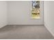 Spacious bedroom with carpeted floors and large window at 1641 Lacebark Elm Way, Lawrenceville, GA 30045