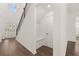 Inviting entryway with built-in bench seating and hardwood floors at 1641 Lacebark Elm Way, Lawrenceville, GA 30045
