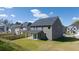 Two story house with gray siding, covered patio and fenced backyard at 1641 Lacebark Elm Way, Lawrenceville, GA 30045