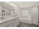 Bathroom with double vanity, tile floor, separate shower, and garden tub at 1641 Lacebark Elm Way, Lawrenceville, GA 30045