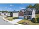 Two-story house with two-car garage and well maintained lawn at 1641 Lacebark Elm Way, Lawrenceville, GA 30045