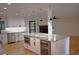 Modern kitchen with white cabinets, granite island, and hardwood floors at 3331 Elm Creek Nw Dr, Marietta, GA 30064