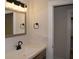 Bathroom features a vanity with a white sink and a mirrored medicine cabinet at 3331 Elm Creek Nw Dr, Marietta, GA 30064