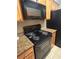 Black electric range and microwave at 2955 Seven Pines Ln # 206, Atlanta, GA 30339
