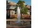 Tall fountain in a plaza with a building in the background at 2992 Evanshire Ave, Duluth, GA 30096