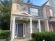 Brick two story townhome with covered porch at 4870 Hairston Park Sq, Stone Mountain, GA 30083