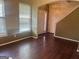 Bright entryway with hardwood floors, natural light, and access to stairs at 4870 Hairston Park Sq, Stone Mountain, GA 30083