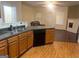 Kitchen with dark wood cabinets and a dishwasher at 4870 Hairston Park Sq, Stone Mountain, GA 30083